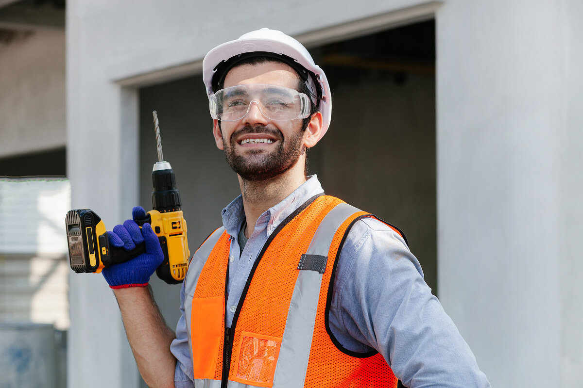 handsome engineer or a construction worker holding LHUD8UC